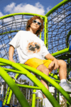 oversized-t-shirt-mockup-featuring-a-man-smiling-in-a-playground-game-m53349_3_optimized_100