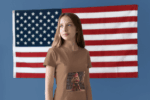 woman-wearing-a-t-shirt-mockup-in-a-room-with-an-american-flag-a20700_3_optimized_100